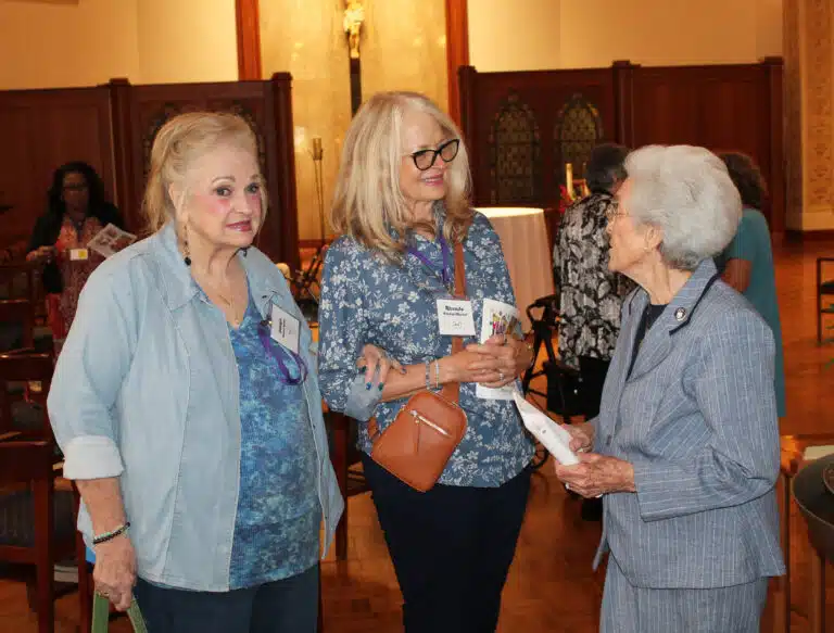 Georgia Warren Bottles A’68, left, and Rhonda Warren Mischel A’73, talk with Sister Elaine Burke A’49, following Mass. Georgia Warren Bottles A’68, left, and Rhonda Warren Mischel A’73, talk with Sister Elaine Burke A’49, following Mass.