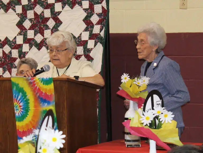 Sister Cecelia Joseph Olinger A’58, left, and Sister Elaine Burke A’49, read their nomination for Sister Amelia Stenger to receive the Maple Leaf Award. Sister Cecelia Joseph Olinger A’58, left, and Sister Elaine Burke A’49, read their nomination for Sister Amelia Stenger to receive the Maple Leaf Award.