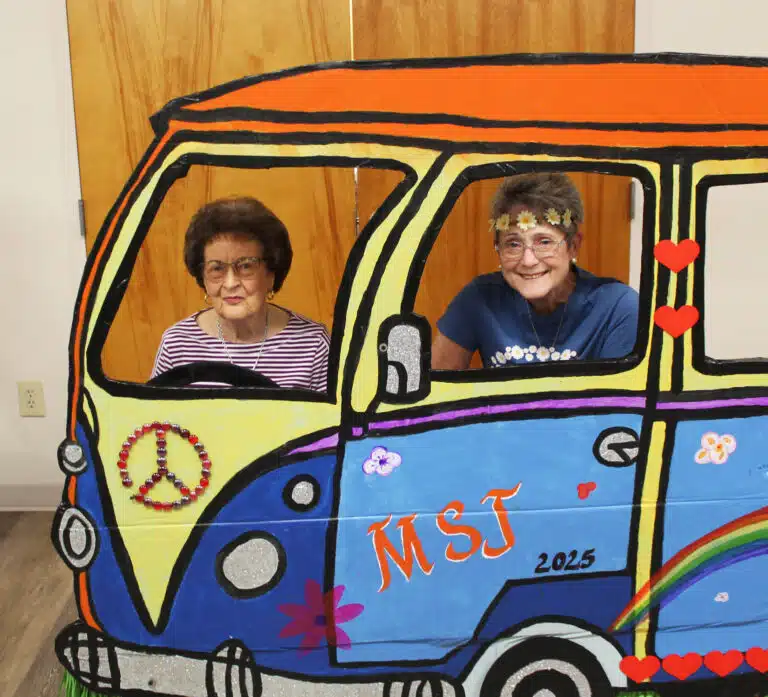 Barbara June Riney Coomes A’52, takes the driver seat, with Stephanie Warren A’73 joining her. Barbara June Riney Coomes A’52, takes the driver seat, with Stephanie Warren A’73 joining her.
