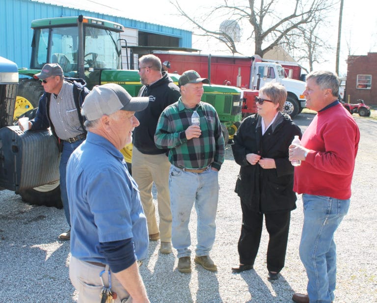 Sister Amelia Stenger talks with a few of the people who came for the auction. At left is Mark Blandford, who retired as farm manager in December 2021, but is serving as a consultant this year for the Sisters.
