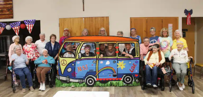 Everyone who gathered for the fun day gathers around the bus. Everyone who gathered for the fun day gathers around the bus.