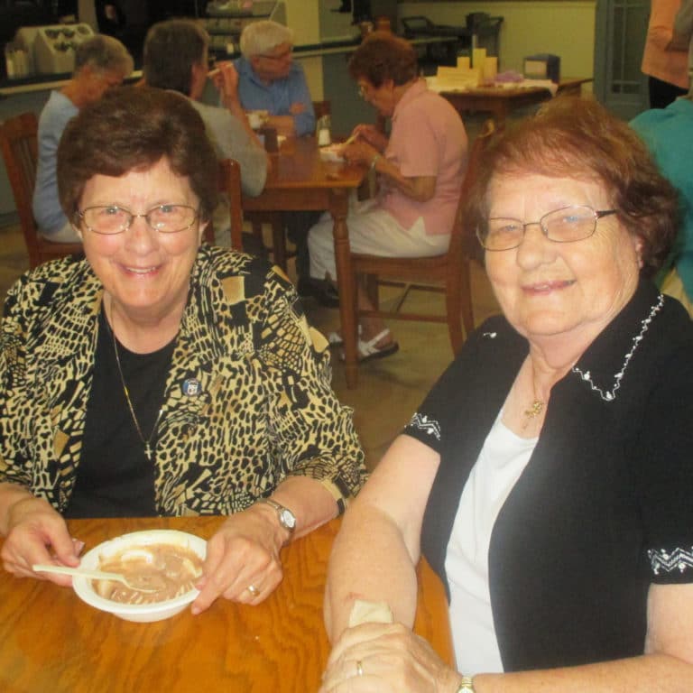 Sister Margaret Ann Aull, left, and Sister Rosanne Spalding polish off some ice cream. The two live together in Owensboro and minister at different churches.