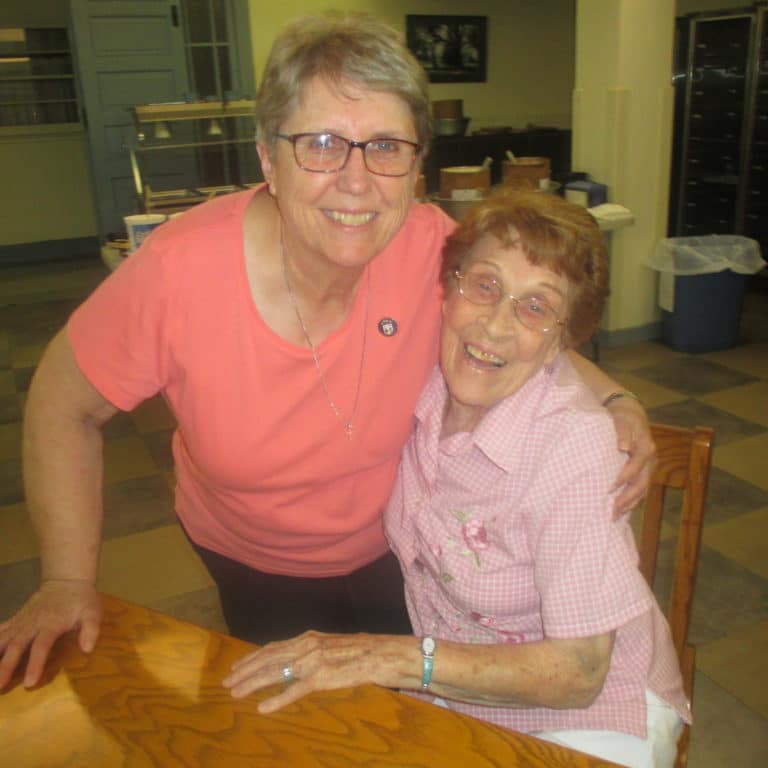 Sister Betsy Moyer, left, knows Sister Elaine Burke is always in a good mood if someone is serving ice cream.