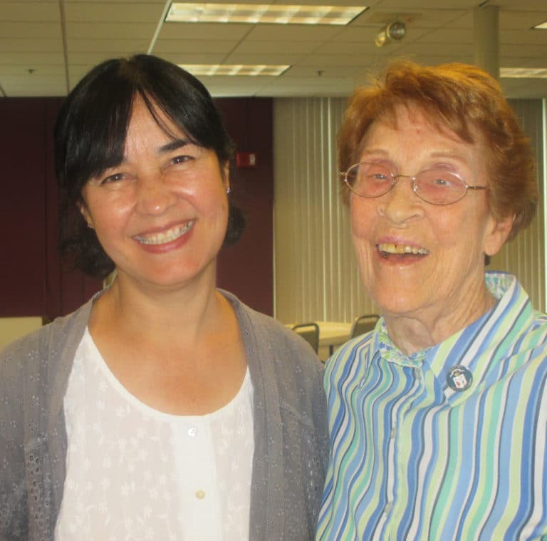 Sister Dianna Ortiz, left, and Sister Elaine Burke are all smiles as the first day of meetings wraps up.