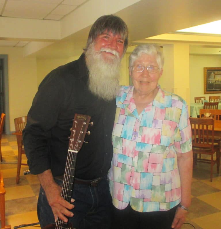 Sister Ruth Gehres visits with musician Dennis Mayfield. He is the son of Ruth Ann Barr Mayfield, A51, who was Sister Ruth’s classmate at Mount Saint Joseph Academy. Many members of the Mayfield family are in music groups that play in local churches and other events.