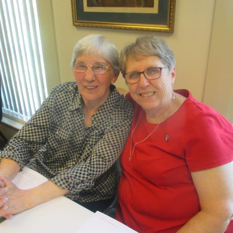 The recording secretaries for Community Days, Sister Julia Head, left, and Sister Betsy Moyer, smile as they realize their work is almost over.