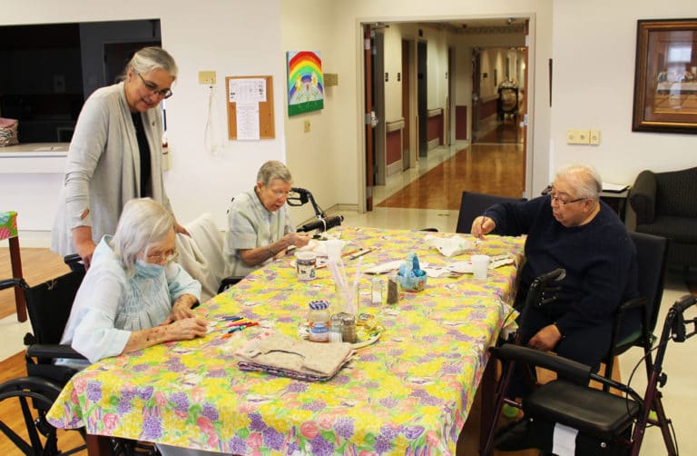 Sister Larraine Lauter, standing, oversees Sister Pat Rhoten’s drawing, as Sister Amanda Rose Mahoney, center, and Sister Sara Marie Gomez begin their projects.