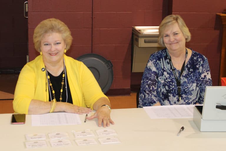 Louisville Associate Suzanne Reiss, left, staffs the registration desk with Carol Braden-Clarke, director of Development for the Ursuline Sisters.