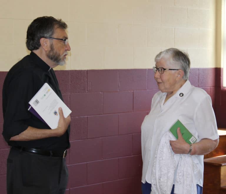 Father Larry Hostetter, the president of Brescia University and the keynote speaker for the day, talks with Sister Ruth Gehres during the morning. Sister Ruth was president of Brescia from 1986-1995.