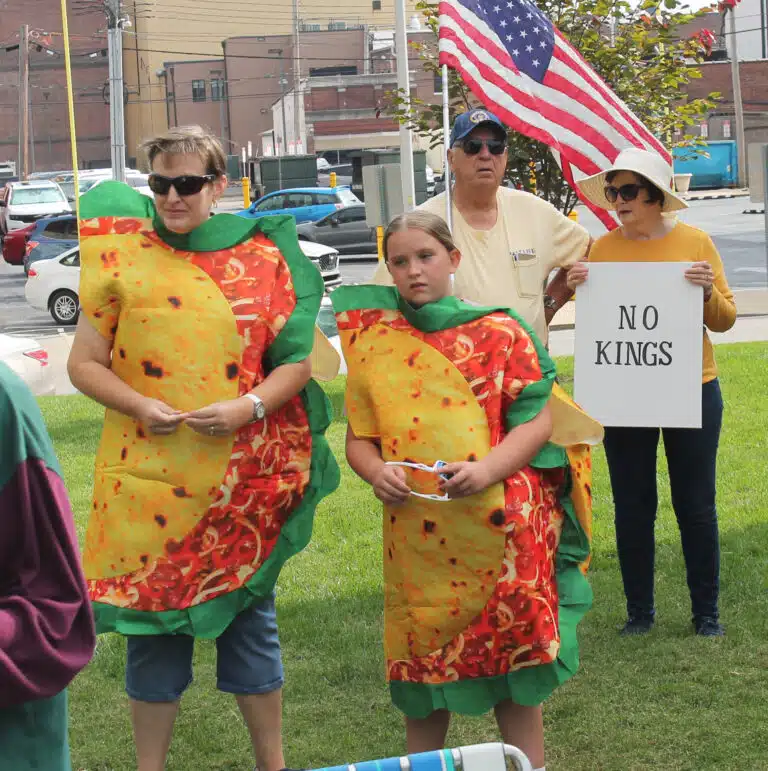 Ursuline Associate Amy Fogle-Stiff and her daughter Melody dressed as tacos during the rally.