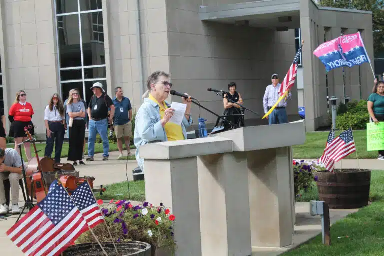 Sister Sharon Sullivan speaks on the Daviess County Courthouse lawn during the 