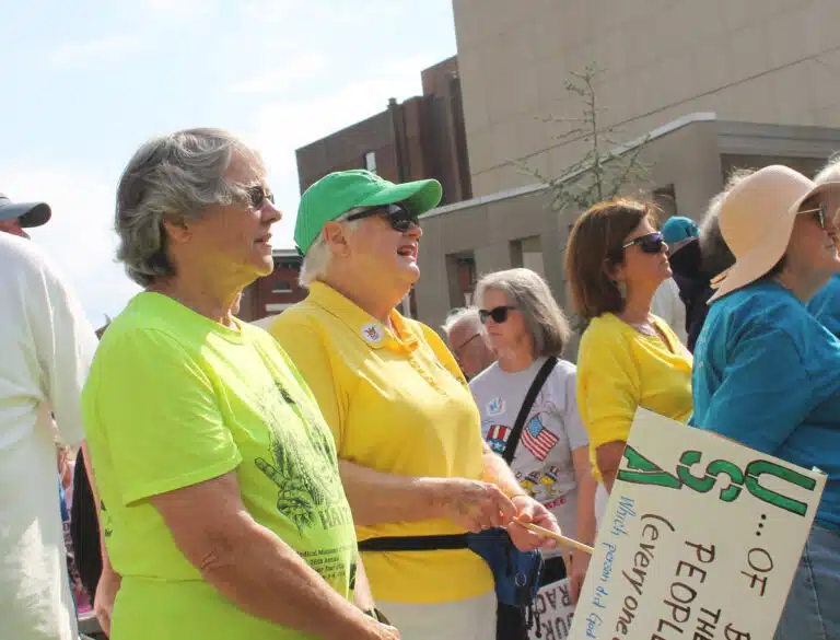 Sister Jacinta Powers, left, and Sister Suzanne Sims join in the rally.