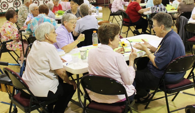 Following the instruction of drawing on the leaf, the table participants were urged to share with the others at their table. From left are Sisters Mary Celine Weidenbenner, Emma Anne Munsterman, Mary Henning and Sharon Sullivan.