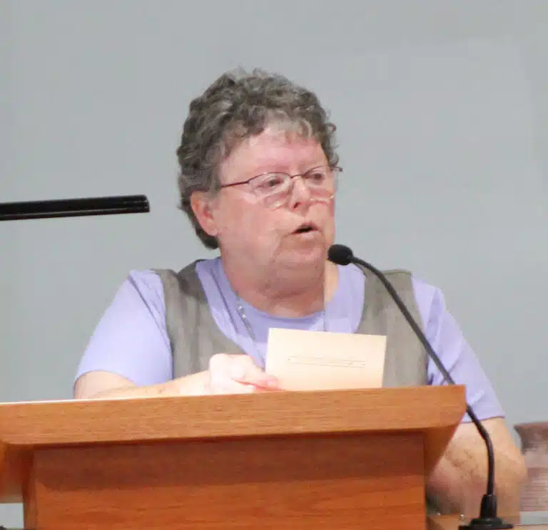 Glenmary Sister Darlene Grimsley, a member of the Steering Committee for the Council of Religious, welcomes everyone and reads a letter to the sisters from Heather Greene, director of the Office of Music. Glenmary Sister Darlene Grimsley, a member of the Steering Committee for the Council of Religious, welcomes everyone and reads a letter to the sisters from Heather Greene, director of the Office of Music.