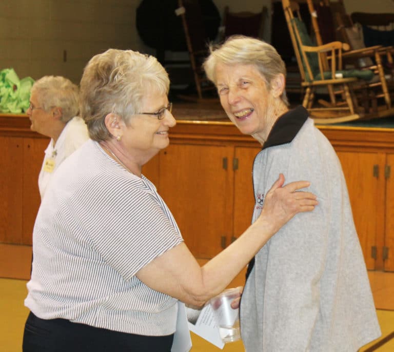 Western Kentucky Associate Lois Bell, left, gets a laugh out of Sister Maureen O’Neill as the day concludes.
