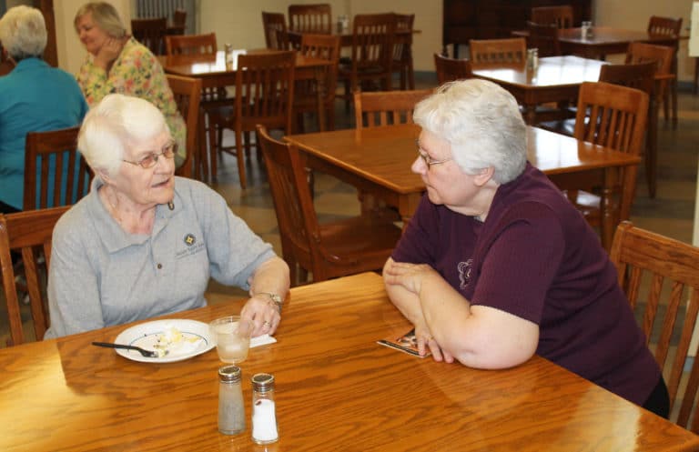 Sister Pat Lynch, right, talks with Sister Mary Matthias Ward during the reception. Sister Mary Matthias was superior of the community from 1988-96.