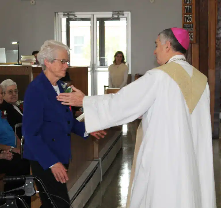 Ursuline Sister Barbara Jean Head is thanked by Bishop Medley for her 60 years of service. She continues to serve as a senior accountant at Brescia University. Ursuline Sister Barbara Jean Head is thanked by Bishop Medley for her 60 years of service. She continues to serve as a senior accountant at Brescia University.