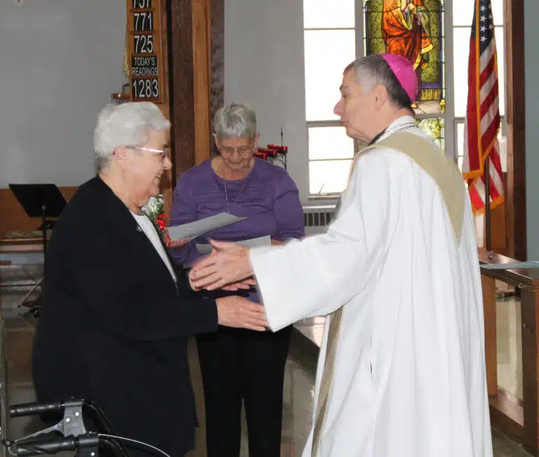 Ursuline Sister Ann McGrew is thanked by Bishop Medley for her 60 years of service. Sister Ann is the treasurer for the Ursuline Sisters at the Motherhouse and is an elected member of the Leadership Council. Ursuline Sister Ann McGrew is thanked by Bishop Medley for her 60 years of service. Sister Ann is the treasurer for the Ursuline Sisters at the Motherhouse and is an elected member of the Leadership Council.