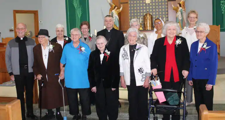 The jubilarians were joined by Father Jerry Riney, left, who is celebrating 50 years since his ordination this year. In the first row from left are Franciscan Sister Lucy Bonifas, and Ursuline Sisters Emma Anne Munsterman, Marie Joseph Coomes, Elaine Burke, Francis Louise Johnson and Barbara Jean Head; in the second row from left are Ursuline Sisters Ann McGrew and Mary Henning, Bishop Medley, Ursuline Sister Jane Falke, Franciscan Sister Consolata Ojemeh, and School Sister of Notre Dame Janette Fennewald. The jubilarians were joined by Father Jerry Riney, left, who is celebrating 50 years since his ordination this year. In the first row from left are Franciscan Sister Lucy Bonifas, and Ursuline Sisters Emma Anne Munsterman, Marie Joseph Coomes, Elaine Burke, Francis Louise Johnson and Barbara Jean Head; in the second row from left are Ursuline Sisters Ann McGrew and Mary Henning, Bishop Medley, Ursuline Sister Jane Falke, Franciscan Sister Consolata Ojemeh, and School Sister of Notre Dame Janette Fennewald.