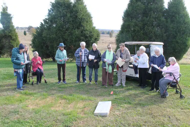 Sisters and staff gather around Sister Sheila Anne Smith’s grave to pray with Kathryn McSorley, fourth from the left, who is Sister Sheila’s friend from New Mexico. From left are Sister Jane Falke, Ashley Wilkerson (coordinator of activities and pastoral care in Saint Joseph Villa), Sister Mary Gerald Payne, Kathryn McSorley, Sister Michele Morek, Sister Maureen O’Neill, Sister Rebecca White, Amy Fogle-Stiff (director of Local Community Life), Sister Karla Kaelin, Sister Elaine Burke, Sister Ann Patrice Cecil and Sister Marie Joseph Coomes.
