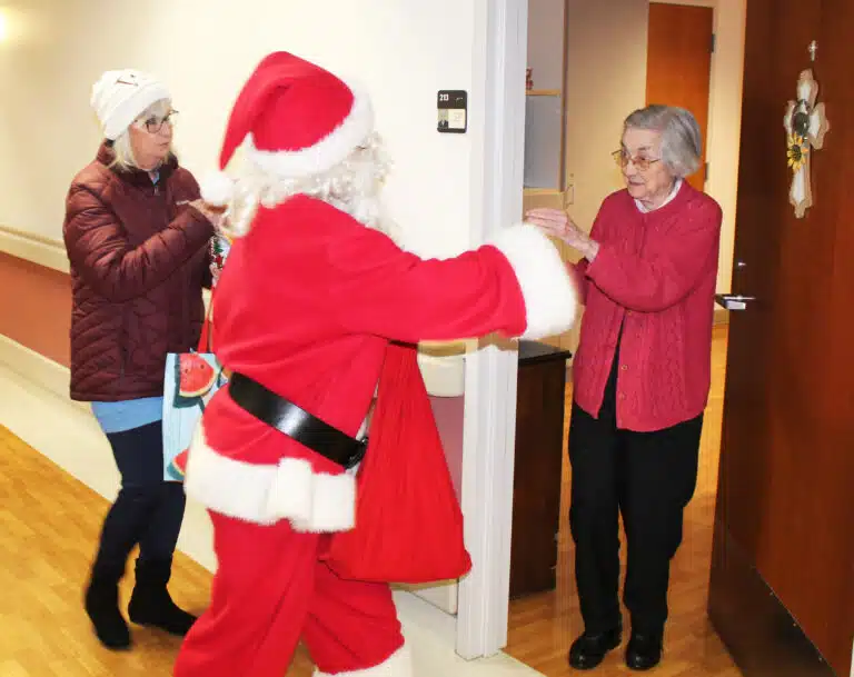 Sister Mary Gerald Payne was very excited to get her treat from Santa Claus.