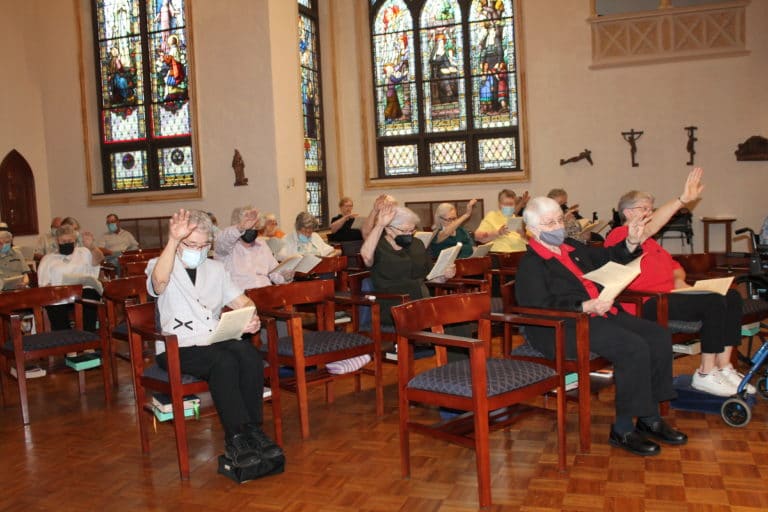 The Ursuline Sisters raise their hands in blessing over the new Council and pray with Saint Angela’s words, “May the strength and true consolation of the Holy Spirit be with you all so that you can maintain and carry out vigorously and faithfully the charge laid upon you.”