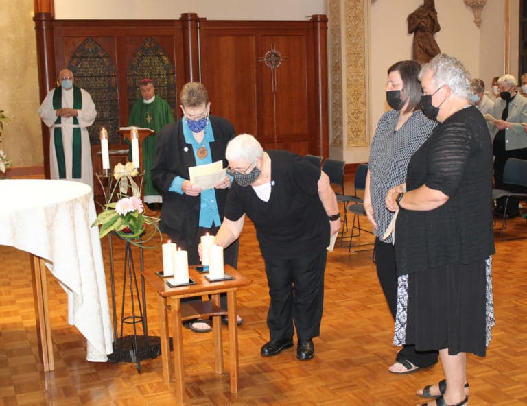 Each of the new Council members placed their candles next to the altar. Sister Ann McGrew is the final Sister to place her candle.