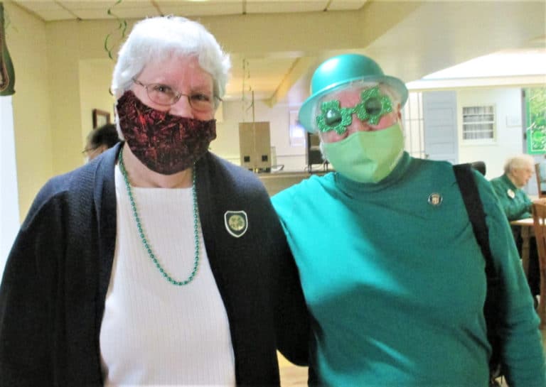 Sister Pat Lynch, left, celebrates her feast day with Sister Suzanne Sims, doing her best Elton John impersonation.