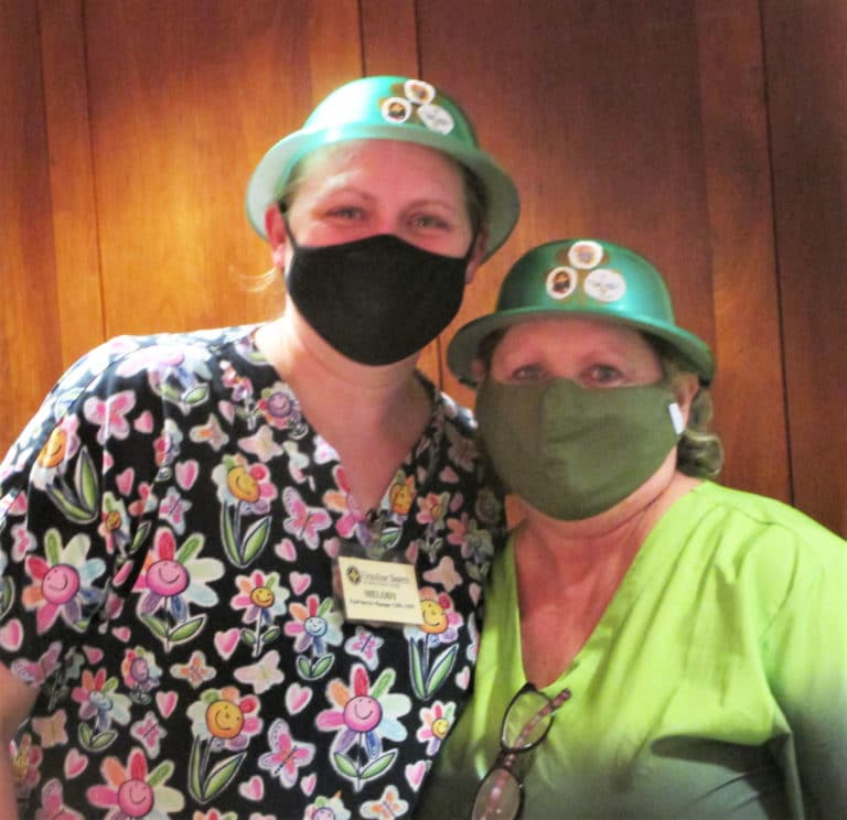 Melody Payne, left, head of Food Service, and employee Charlotte Stelmach are ready to celebrate.