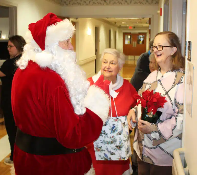 Sister Rebecca White missed last year’s visit from Santa, so this year she made sure to meet him in the hallway. Sister Rebecca White missed last year’s visit from Santa, so this year she made sure to meet him in the hallway.