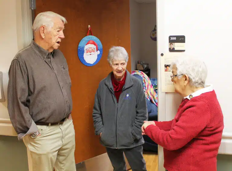 Sister Joan Riedley, center, chats with two of Santa’s elves, Associate Mike Sullivan and Sister Cecelia Joseph Olinger. Sister Joan Riedley, center, chats with two of Santa’s elves, Associate Mike Sullivan and Sister Cecelia Joseph Olinger.