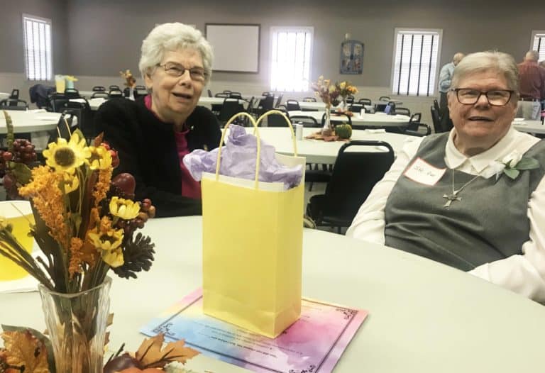 Ursuline Sister Nancy Murphy, left, a member of the Steering Committee for the Council of Religious, gathers with Glenmary Sister Pat Leighton for lunch.