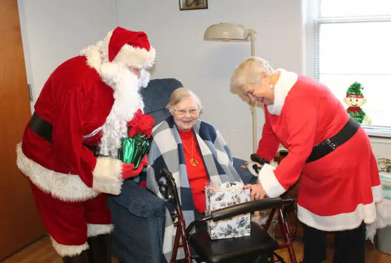 Sister Marie Joseph Coomes gets Mrs. Claus laughing over something she said. Sister Marie Joseph Coomes gets Mrs. Claus laughing over something she said.