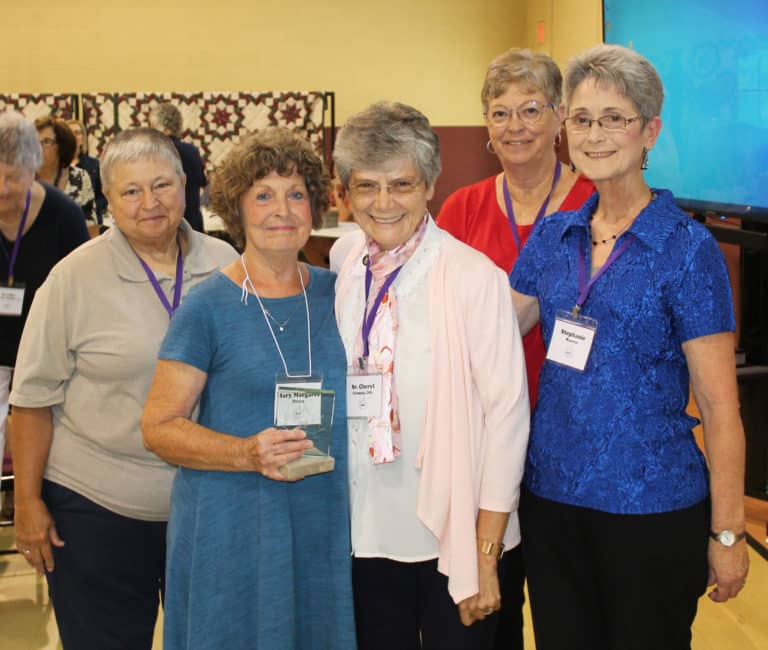 Mary Margaret Drury A’66, second from left, holds her Maple Leaf Award. To the left is Mary Danhauer, then her nominator Sister Cheryl Clemons, followed by Paula Chandler Gray and Stephanie Warren.