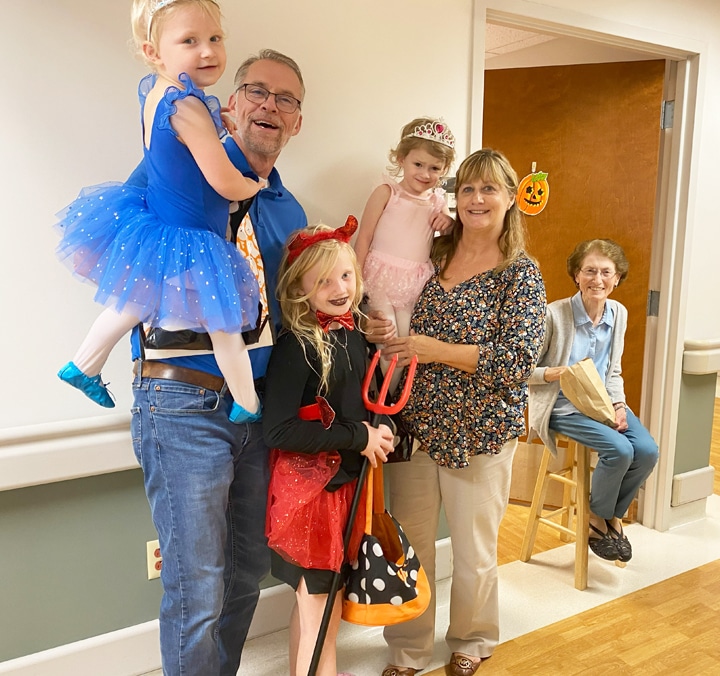 Human Resources Director Dee Dee Jackson and her husband, Kevin, brought their granddaughters Charlie, Lily and Claire for trick-or-treating. In the background, Sister Claudia Hayden is ready to pass out candy.