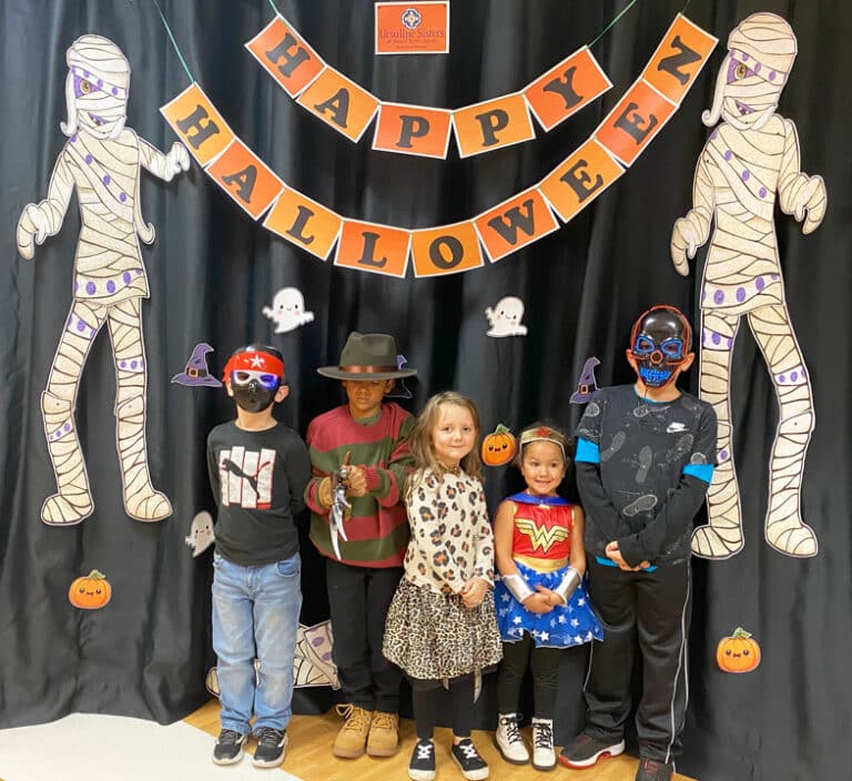There are some pretty scary dudes in this picture, it’s a good thing Wonder Woman is there. The grandchildren of Pat Burden of Almost Family, from left, Brantley, Titus, Kensleigh, Amira and Major.