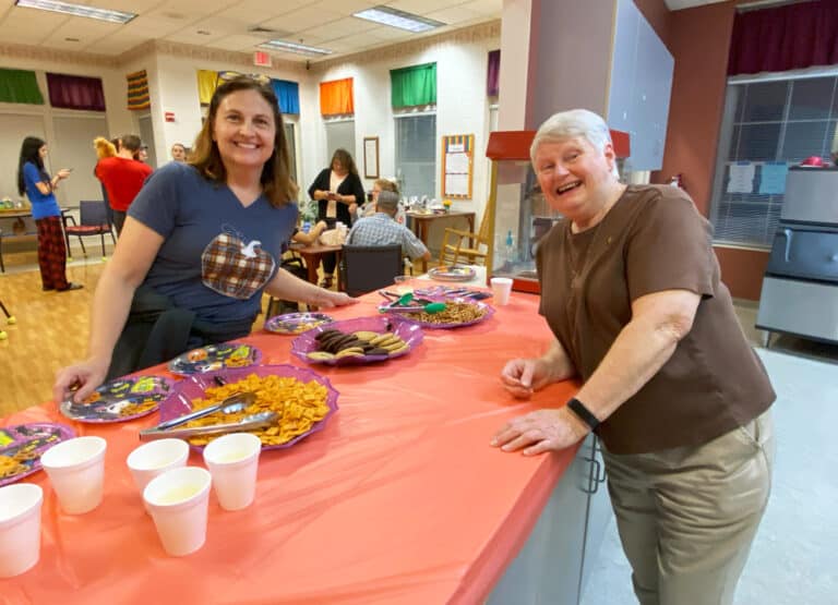 Debbie Turner, left, a nurse in the Villa, and Sister Suzanne Sims prepare the treats for all the trick-or-treaters in the Rainbow Room.