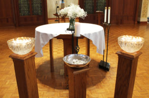 As the sisters departed the service, they left behind their lighted candles floating in two bowls of water in memory of the Gossip Tree.