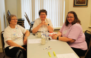 Sister Amelia Stenger, center, visits with her sister, Mary Teder, left, and her niece Joan Teder, who are both associates in Missouri.