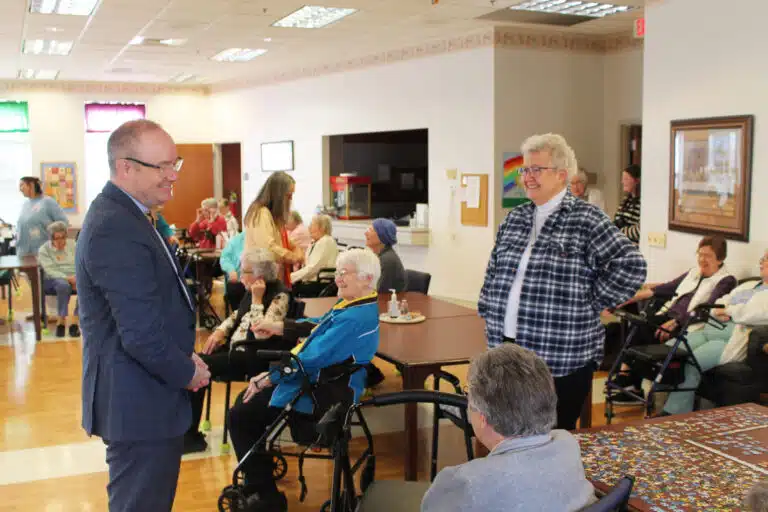Brescia President Madison Silvert, left, chats with Sister Michele Morek, standing at right, and Sister Margaret Ann Aull, seated. Sister Michele served at Brescia for more than 30 years. Brescia President Madison Silvert, left, chats with Sister Michele Morek, standing at right, and Sister Margaret Ann Aull, seated. Sister Michele served at Brescia for more than 30 years.