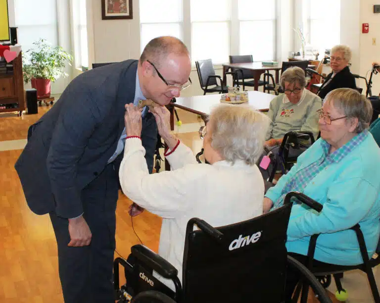 Sister Pat Rhoten straightens Madison Silvert’s tie before he began his presentation. Sister Pat served three years at Brescia. “Only Sister Pat and my mom are allowed to straighten my tie,” Silvert said. Sister Pat has known Silvert’s wife Amy since she was a little girl. Sister Pat Rhoten straightens Madison Silvert’s tie before he began his presentation. Sister Pat served three years at Brescia. “Only Sister Pat and my mom are allowed to straighten my tie,” Silvert said. Sister Pat has known Silvert’s wife Amy since she was a little girl.