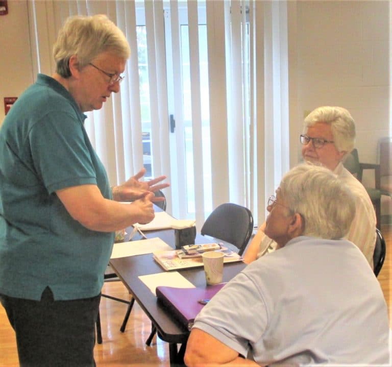 Sister Rita Scott makes a point to Sister Mary Celine Weidenbenner, center, and Sister Mary Timothy Bland.