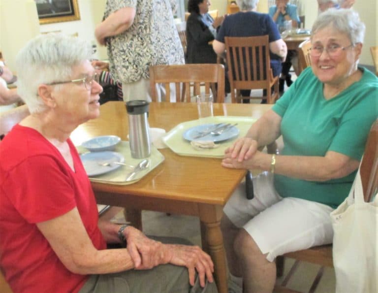 Sister Jane Falke, left, and Sister Karla Kaelin enjoy some after-dinner conversation.