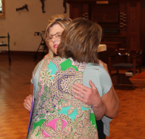 Jeannie Foster gets a hug from Debbie Lanham following her commitment.