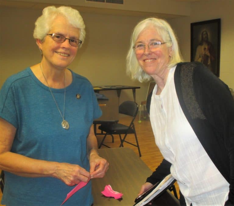 Sister Barbara Jean Head, left, and Sister Nancy Liddy wrap up for the day.