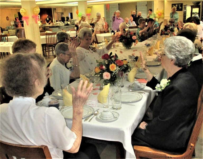 The Sisters who celebrated jubilees of religious profession in 2020 and 2021 gathered at this long table on July 11, as they prayed for one another.