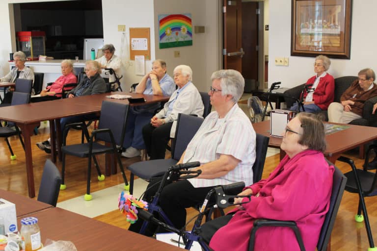 The Sisters are attentive as Father Larry talks about some of the scenarios he’s faced with families who don’t understand Church teaching on cremation. From left are Sisters Nancy Murphy, Grace Swift, Marie Joseph Coomes, Luisa Bickett, Kathleen Dueber, Mary Matthias Ward, Mary Timothy Bland, Lois Lindle, Mary Gerald Payne and Susanne Bauer (in the back by the wall.)