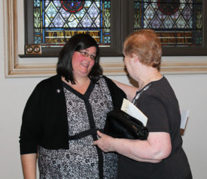 Sister Stephany is congratulated by Ursuline Sister Helena Fischer.