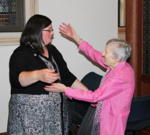 Sister Marietta Wethington prepares to give Sister Stephany a congratulatory hug.