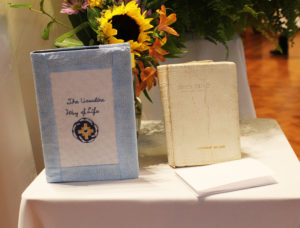 Among the gifts brought up during Mass was this Ursuline Way of Life and this Holy Bible, which Sister Stephany received from her grandmother when she was 5. Also on the gift table are Sister Stephany’s vows.
